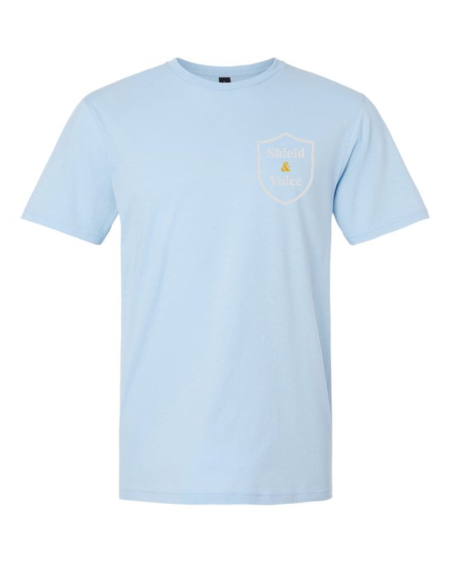 Childhood Is Not a Crime Scene Tee — Light Blue — front pocket mark